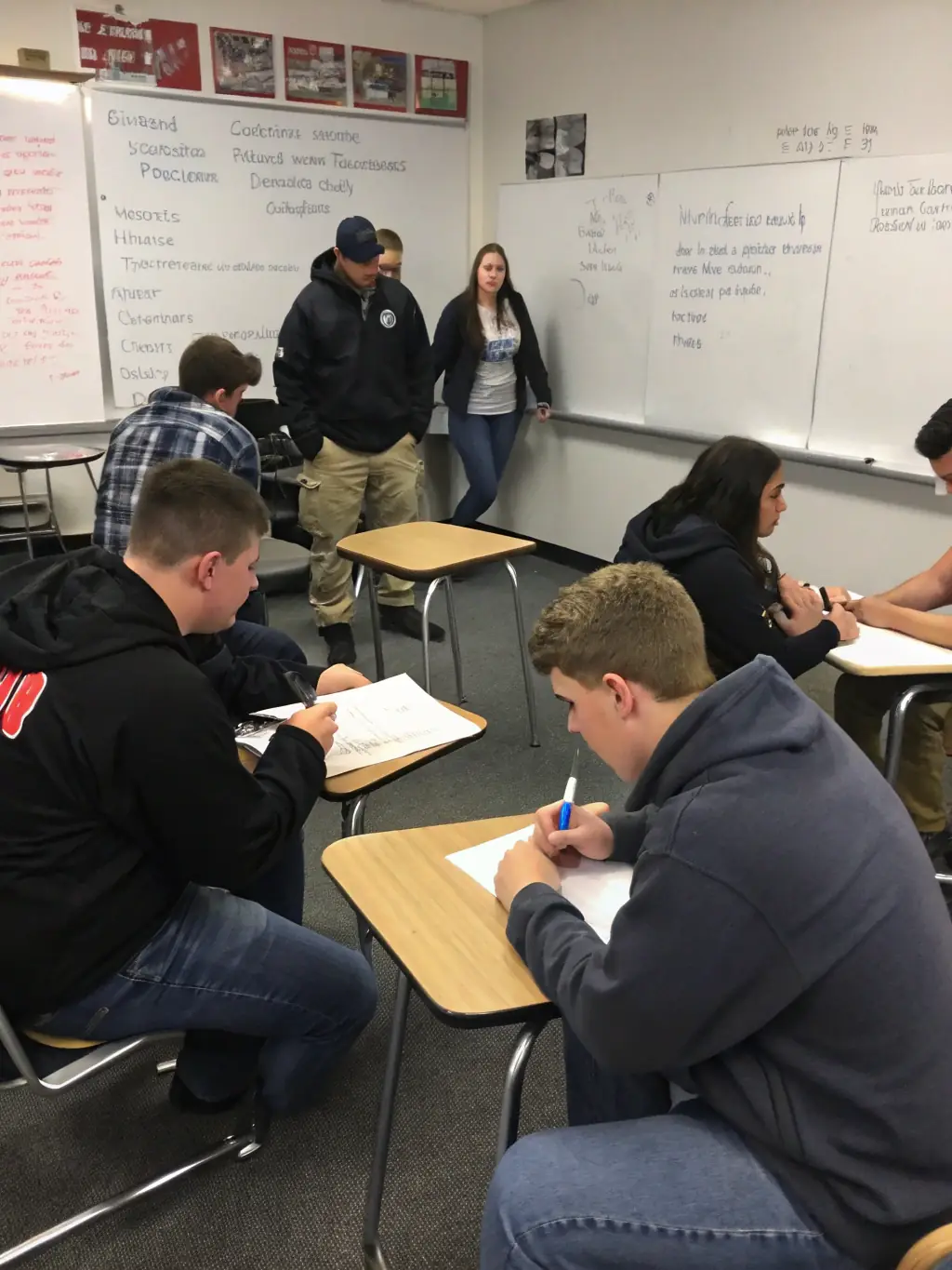 A photo of a certified instructor demonstrating de-escalation techniques during a conflict resolution training session.